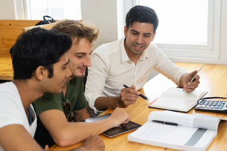 Group discussing DAO Treasury Yield Strategies in a business setting